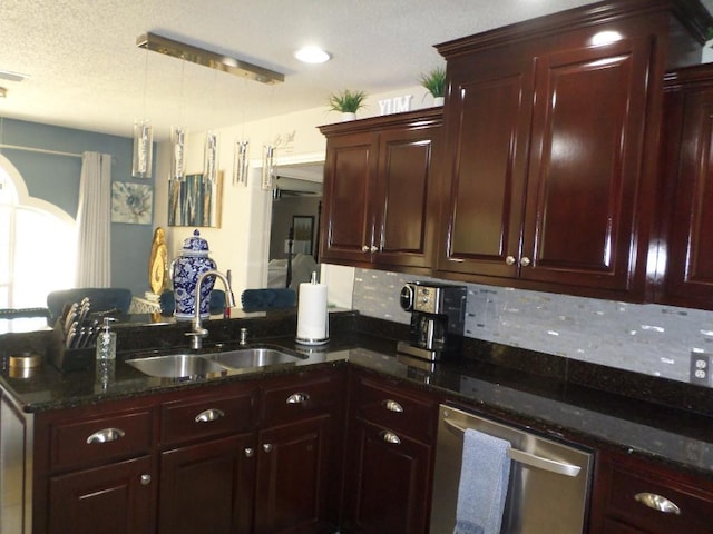 kitchen featuring pendant lighting, a peninsula, reddish brown cabinets, a sink, and dishwasher