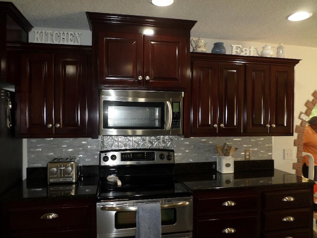 kitchen with appliances with stainless steel finishes, dark brown cabinetry, backsplash, and a textured ceiling