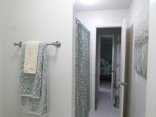 full bathroom featuring tile patterned flooring