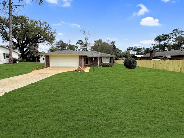 ranch-style house with a front yard and a garage