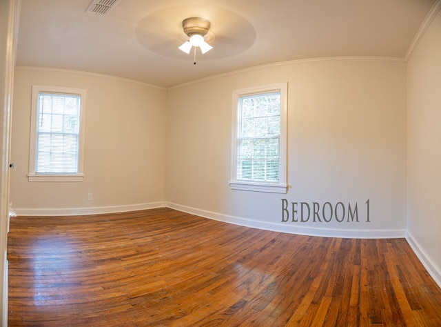 641 Evans, Bainbridge, GA 39819 - unfurnished room with dark wood-type flooring, ceiling fan, baseboards, and crown molding