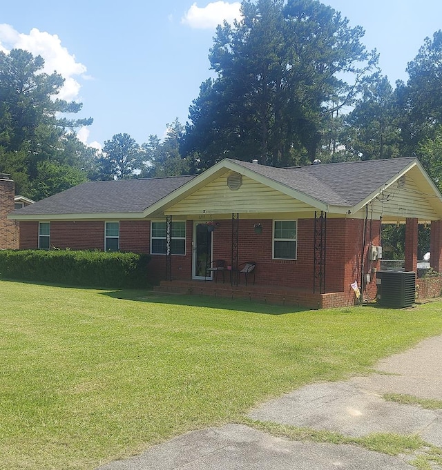 1310 Stone Ave, Cairo, GA 39828 - single story home featuring covered porch, a front lawn, and brick siding