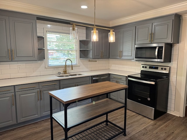 kitchen featuring a sink, open shelves, gray cabinetry, and appliances with stainless steel finishes