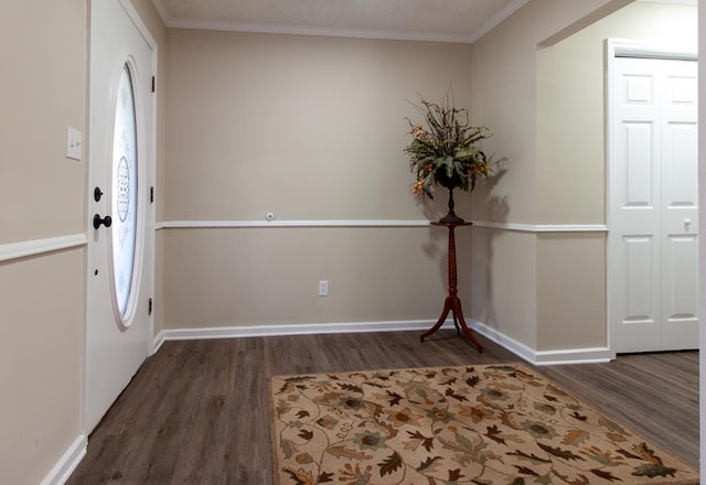 entryway with ornamental molding, baseboards, and wood finished floors