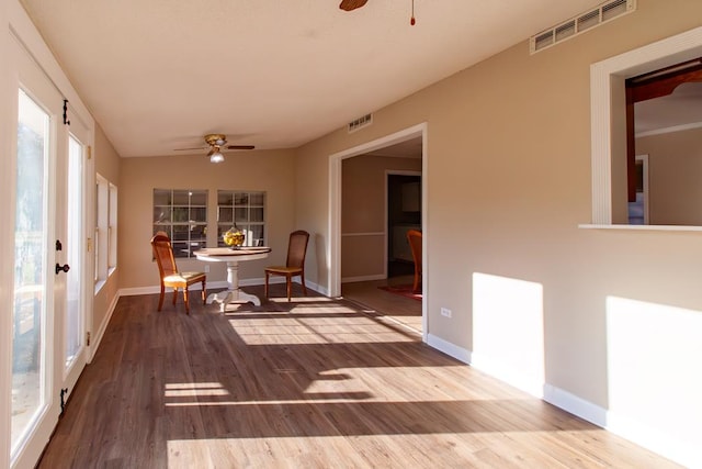 dining space featuring visible vents, wood finished floors, and ceiling fan