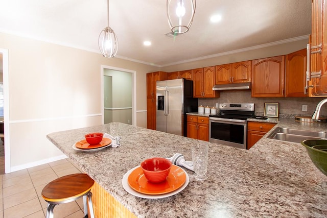kitchen with a sink, under cabinet range hood, backsplash, stainless steel appliances, and crown molding