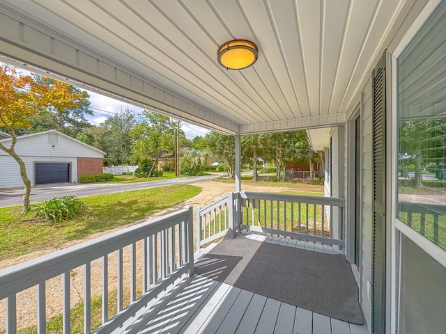 wooden terrace with a porch