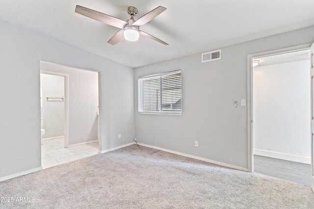 7132 N 63rd Dr, Glendale, AZ 85301 - unfurnished bedroom with carpet flooring, connected bathroom, baseboards, and a ceiling fan
