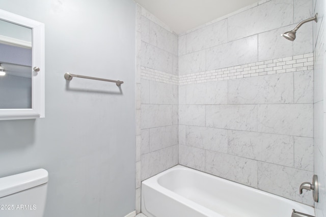 7132 N 63rd Dr, Glendale, AZ 85301 - bathroom with toilet, washtub / shower combination, and baseboards
