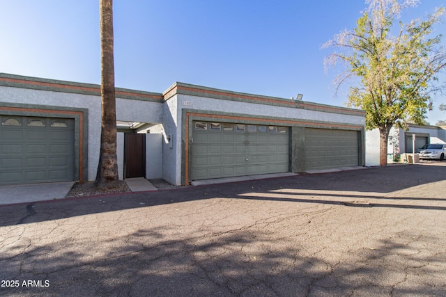 7132 N 63rd Dr, Glendale, AZ 85301 - view of front of home with stucco siding and driveway
