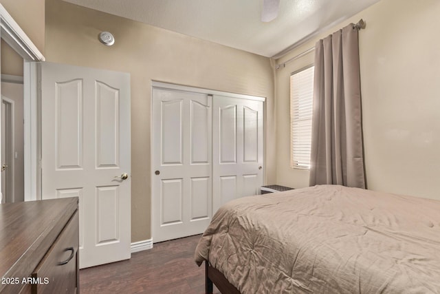 bedroom with a closet and dark wood-style flooring