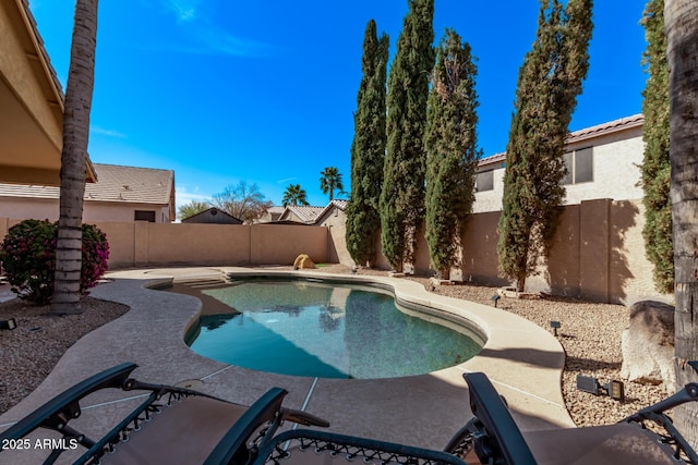 view of swimming pool with a fenced in pool, a patio, and a fenced backyard