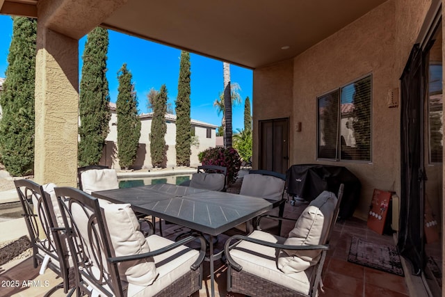 view of patio featuring outdoor dining area and grilling area