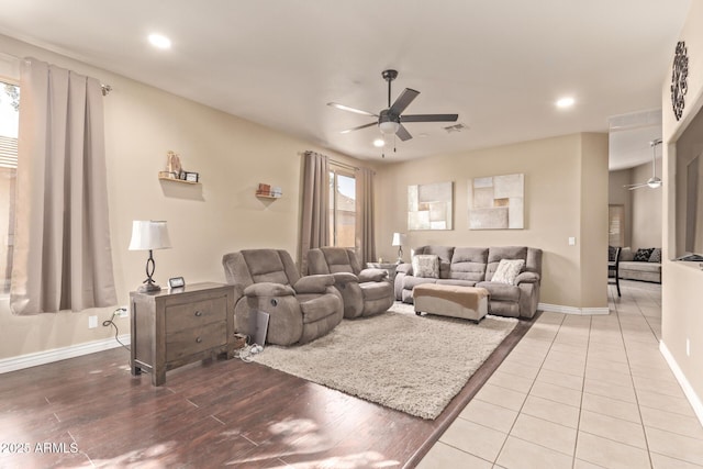 living room with visible vents, plenty of natural light, and ceiling fan