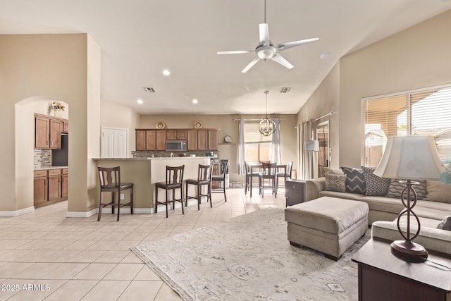 living room with recessed lighting, light tile patterned floors, a ceiling fan, and visible vents