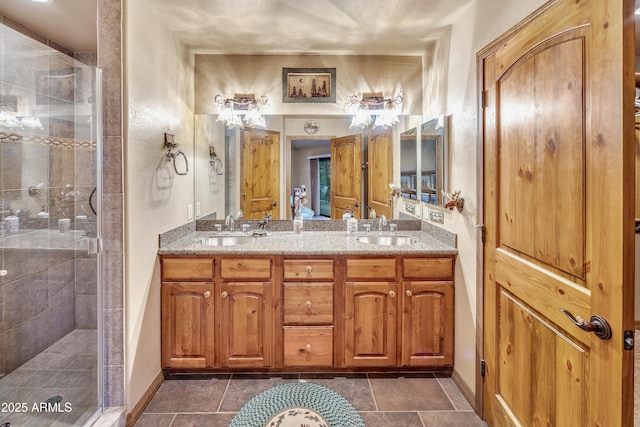 full bath featuring a stall shower and a sink