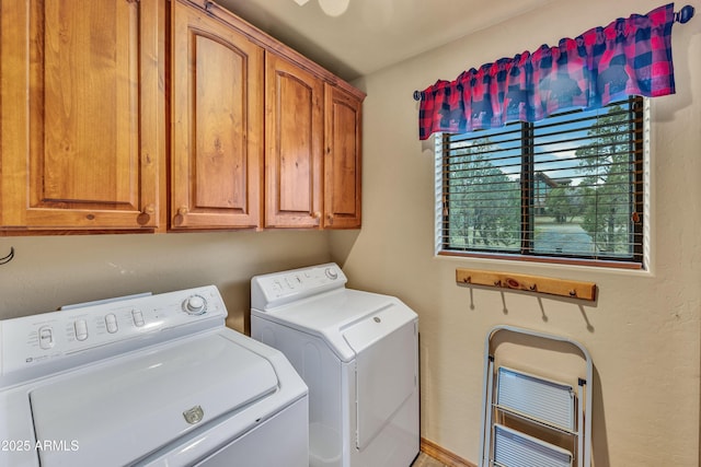 clothes washing area featuring independent washer and dryer, cabinet space, and heating unit