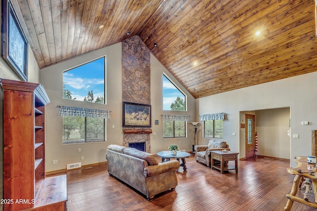 living area with visible vents, hardwood / wood-style flooring, wood ceiling, a fireplace, and high vaulted ceiling