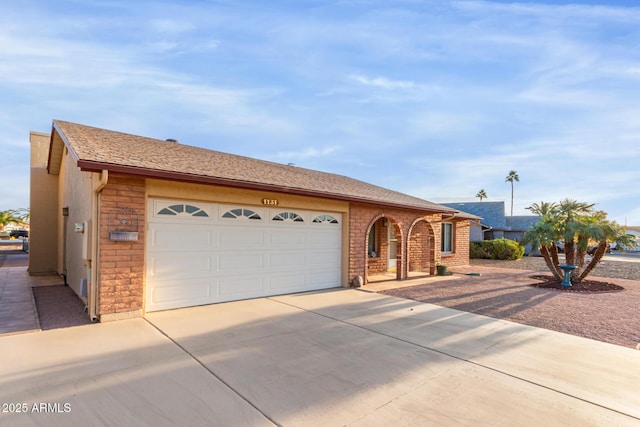 single story home featuring a garage