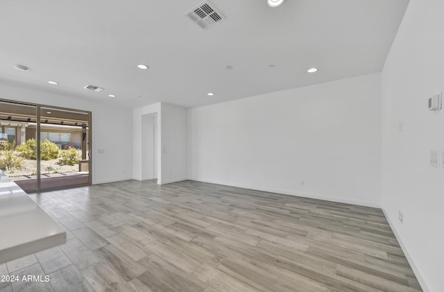 unfurnished living room featuring light hardwood / wood-style floors