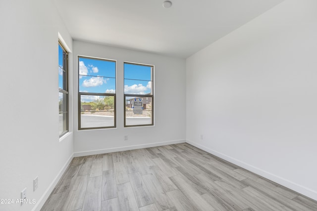 empty room with light wood-type flooring