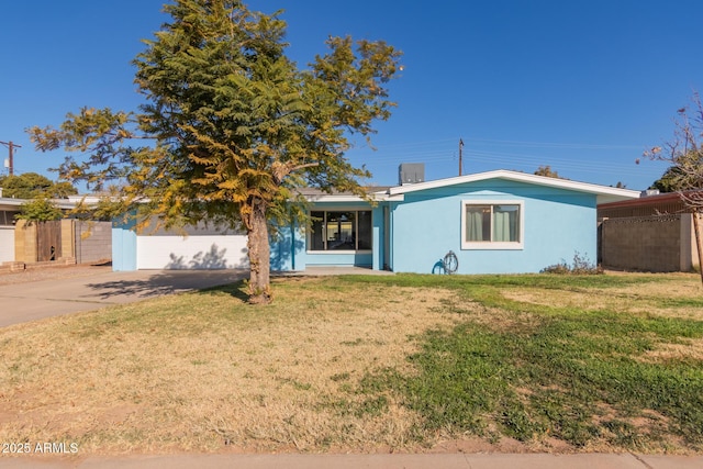 view of front facade with a garage and a front lawn