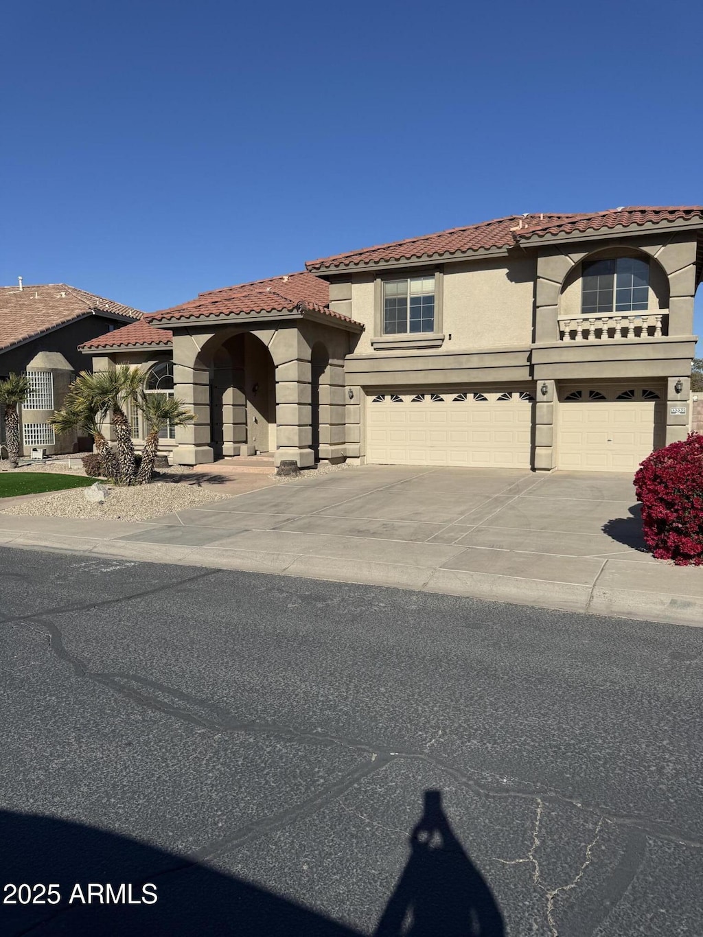 mediterranean / spanish house featuring a garage