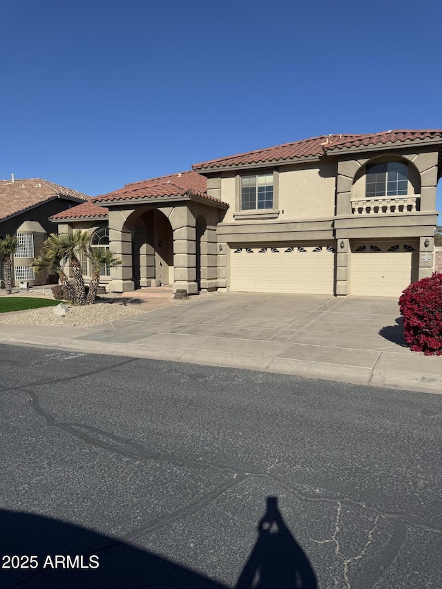 mediterranean / spanish house featuring a garage