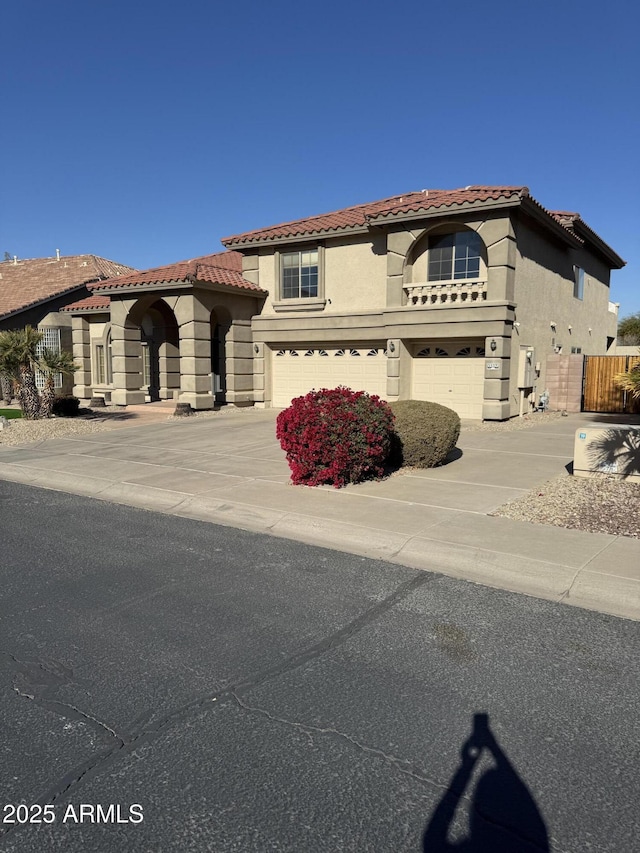 mediterranean / spanish house with a garage