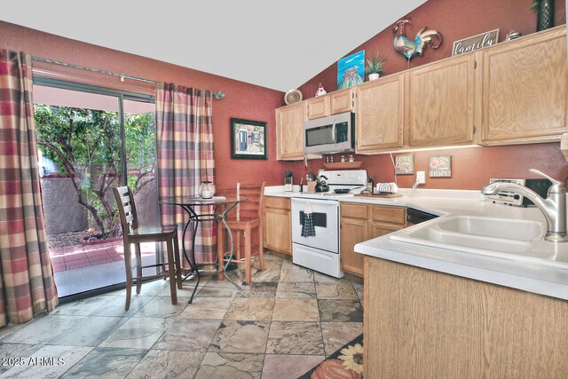 3510 E Hampton Ave Unit 74, Mesa, AZ 85204 - kitchen featuring white electric range, stainless steel microwave, light brown cabinets, stone tile floors, and light countertops