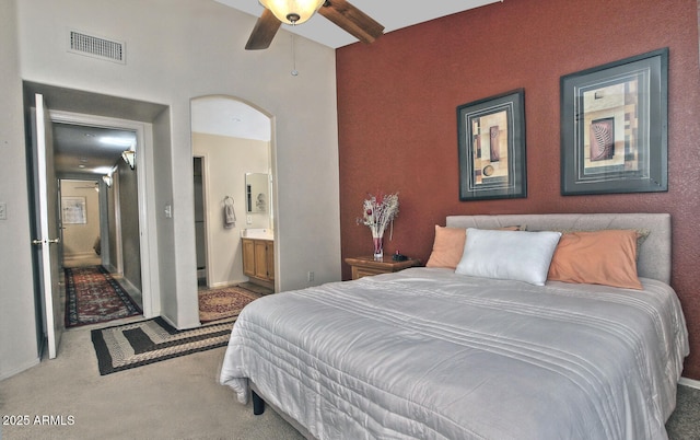3510 E Hampton Ave Unit 74, Mesa, AZ 85204 - bedroom featuring carpet floors, connected bathroom, arched walkways, and baseboards