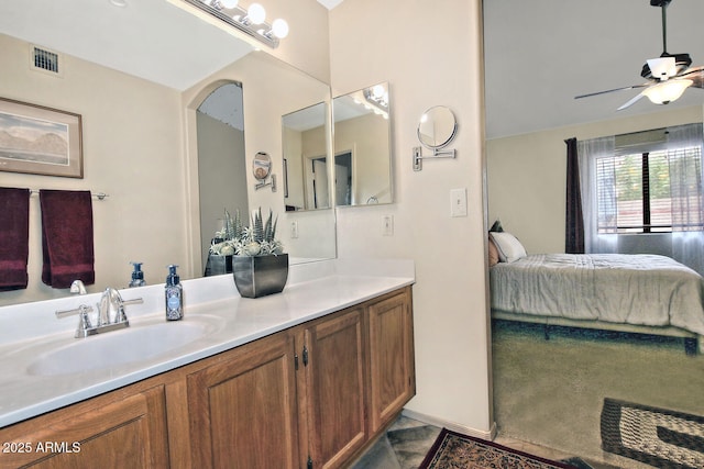 3510 E Hampton Ave Unit 74, Mesa, AZ 85204 - bathroom with connected bathroom, ceiling fan, and vanity