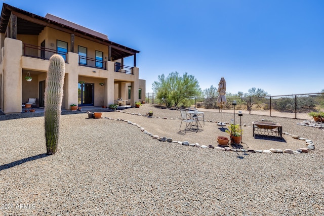 exterior space featuring a balcony and a patio area