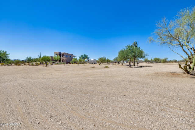 view of yard with a rural view