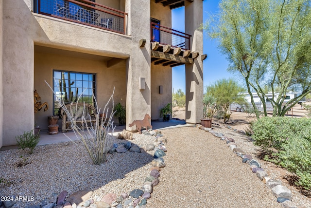 exterior space with a balcony and a patio