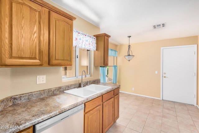 8874 W Piute Ave, Peoria, AZ 85382 - kitchen featuring dishwashing machine, a sink, pendant lighting, light countertops, and brown cabinets