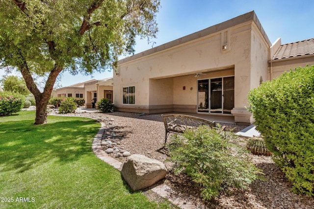 8874 W Piute Ave, Peoria, AZ 85382 - rear view of house with a lawn, stucco siding, and a patio