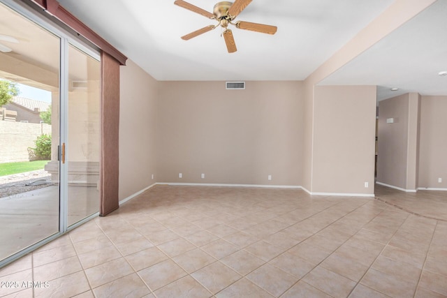 8874 W Piute Ave, Peoria, AZ 85382 - empty room featuring light tile patterned floors, a ceiling fan, and baseboards