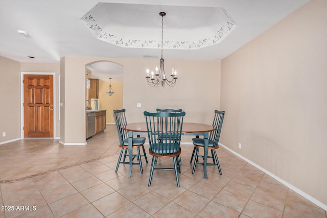 8874 W Piute Ave, Peoria, AZ 85382 - dining area with arched walkways, a chandelier, light tile patterned floors, and baseboards