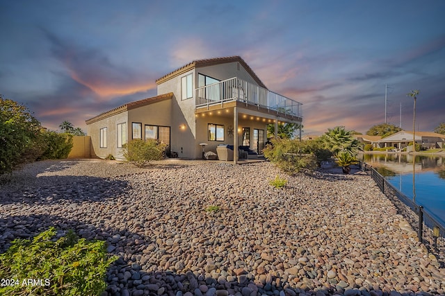 242 E Stonebridge Dr, Gilbert, AZ 85234 - rear view of property featuring stucco siding, a balcony, a patio area, and a tile roof