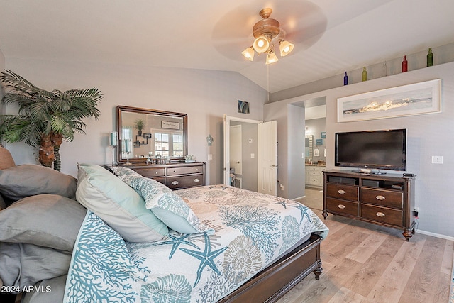 bedroom featuring ceiling fan, light wood-type flooring, and vaulted ceiling