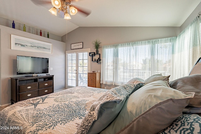 bedroom with ceiling fan, french doors, and lofted ceiling