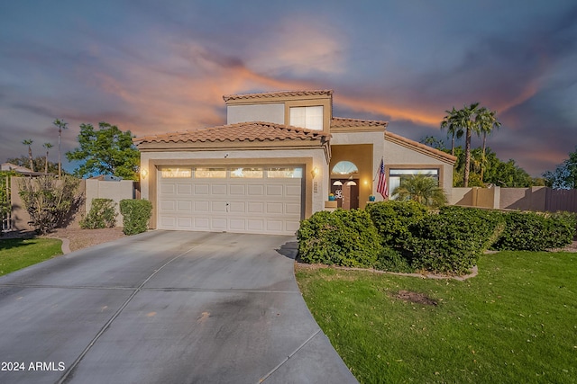242 E Stonebridge Dr, Gilbert, AZ 85234 - mediterranean / spanish house featuring driveway, stucco siding, a garage, and a tiled roof