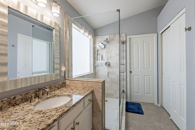 242 E Stonebridge Dr, Gilbert, AZ 85234 - full bathroom with a stall shower, vanity, vaulted ceiling, and tile patterned flooring