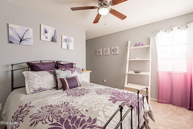 bedroom with ceiling fan and light colored carpet