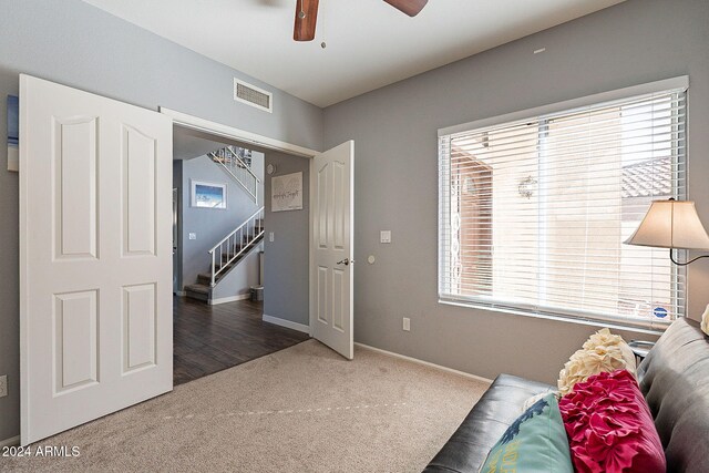 242 E Stonebridge Dr, Gilbert, AZ 85234 - sitting room featuring carpet floors, stairs, a ceiling fan, and baseboards