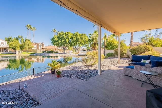 view of patio / terrace featuring an outdoor living space and a water view