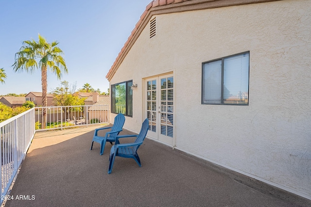 view of patio featuring a balcony