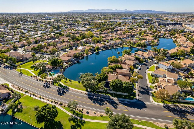 drone / aerial view with a water and mountain view