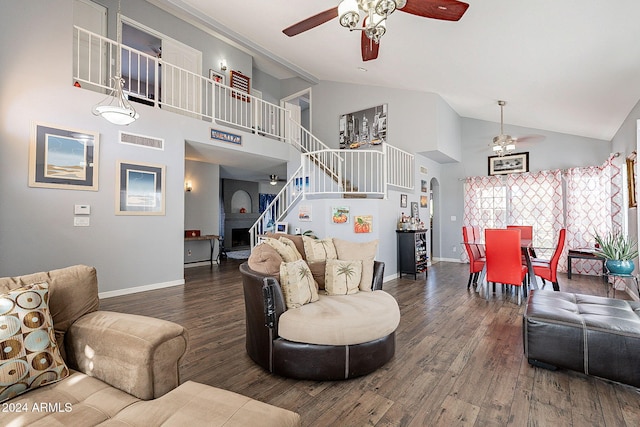 living room with dark hardwood / wood-style floors, ceiling fan, and high vaulted ceiling